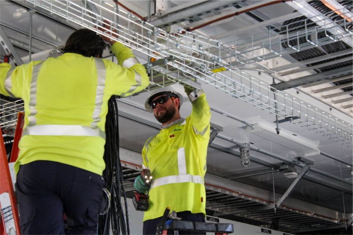 Crown team working on assembling an interior control building